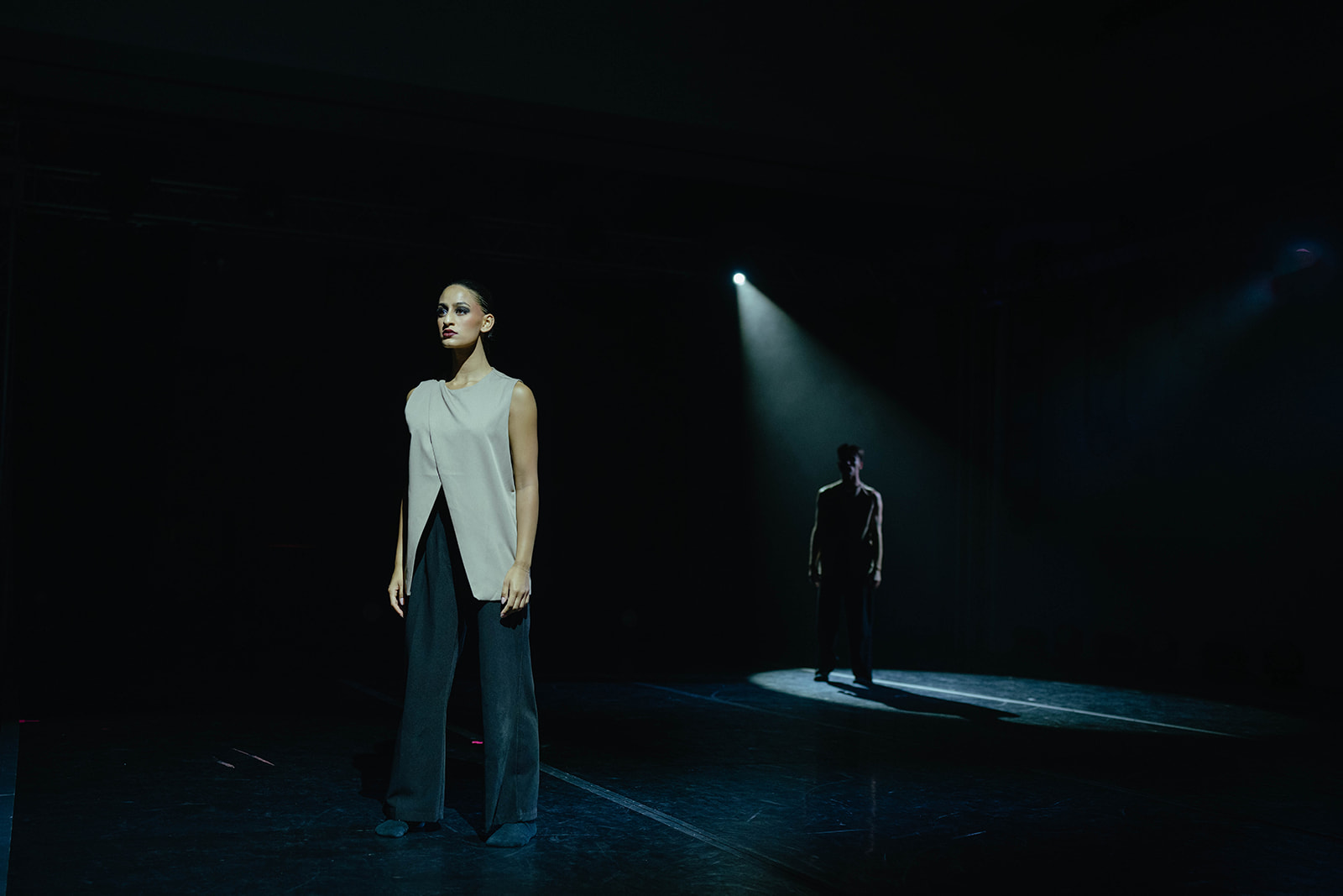 Immersive Show - Figure on dramatically lit stage