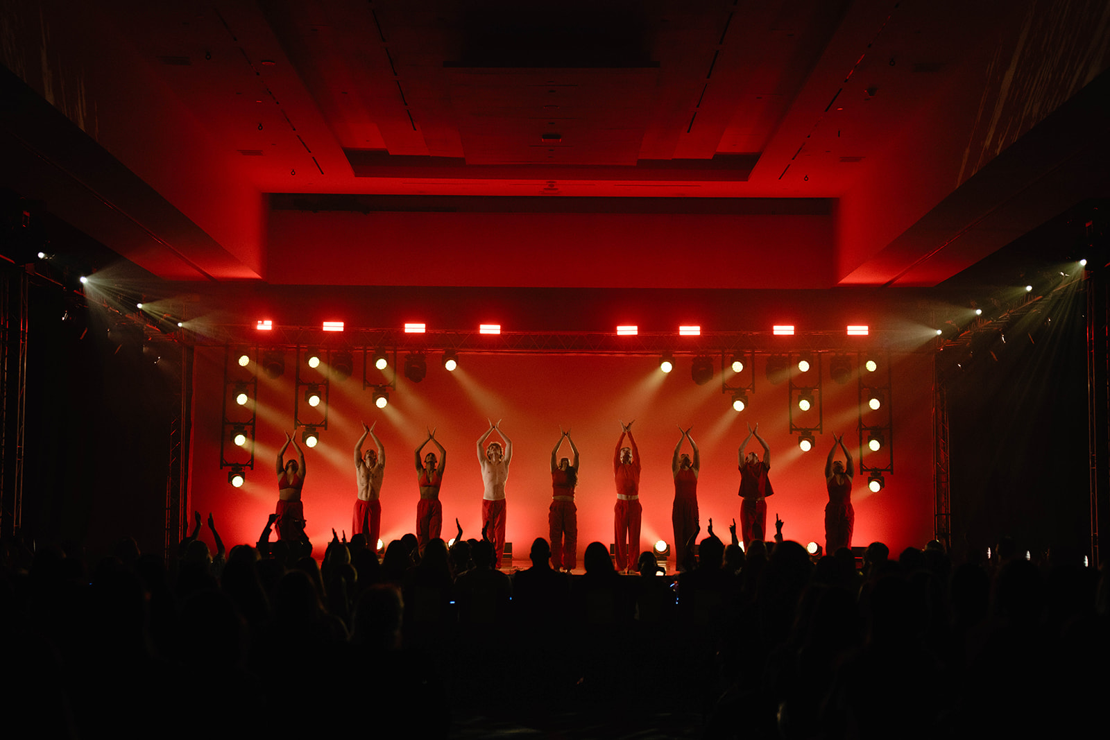 Live Event Production - Stage with green lighting and performers